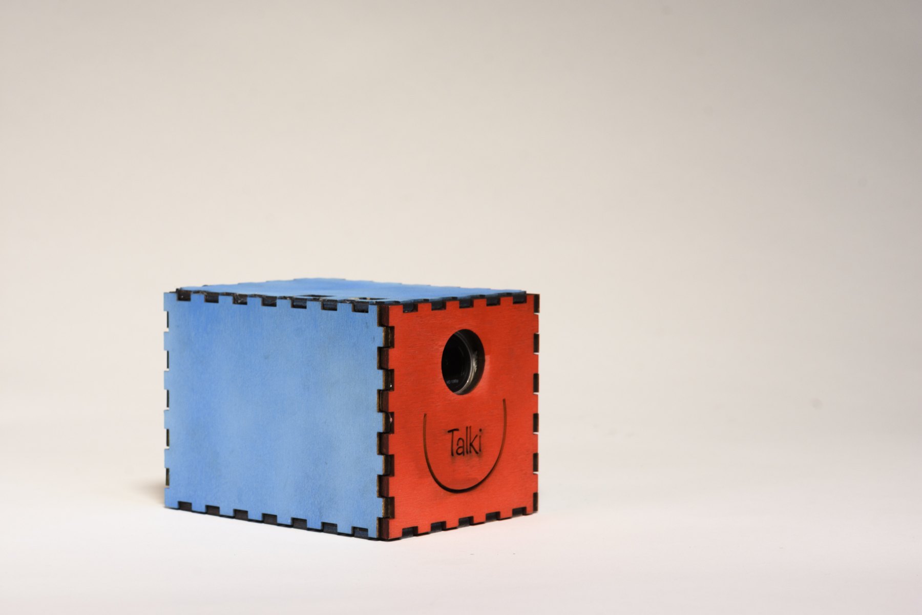 Talki: a small laser-cut wooden box with a camera on the front