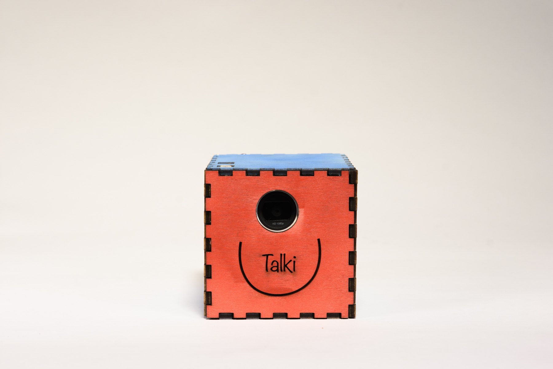 The front of Talki: the camera lens above the engraved name