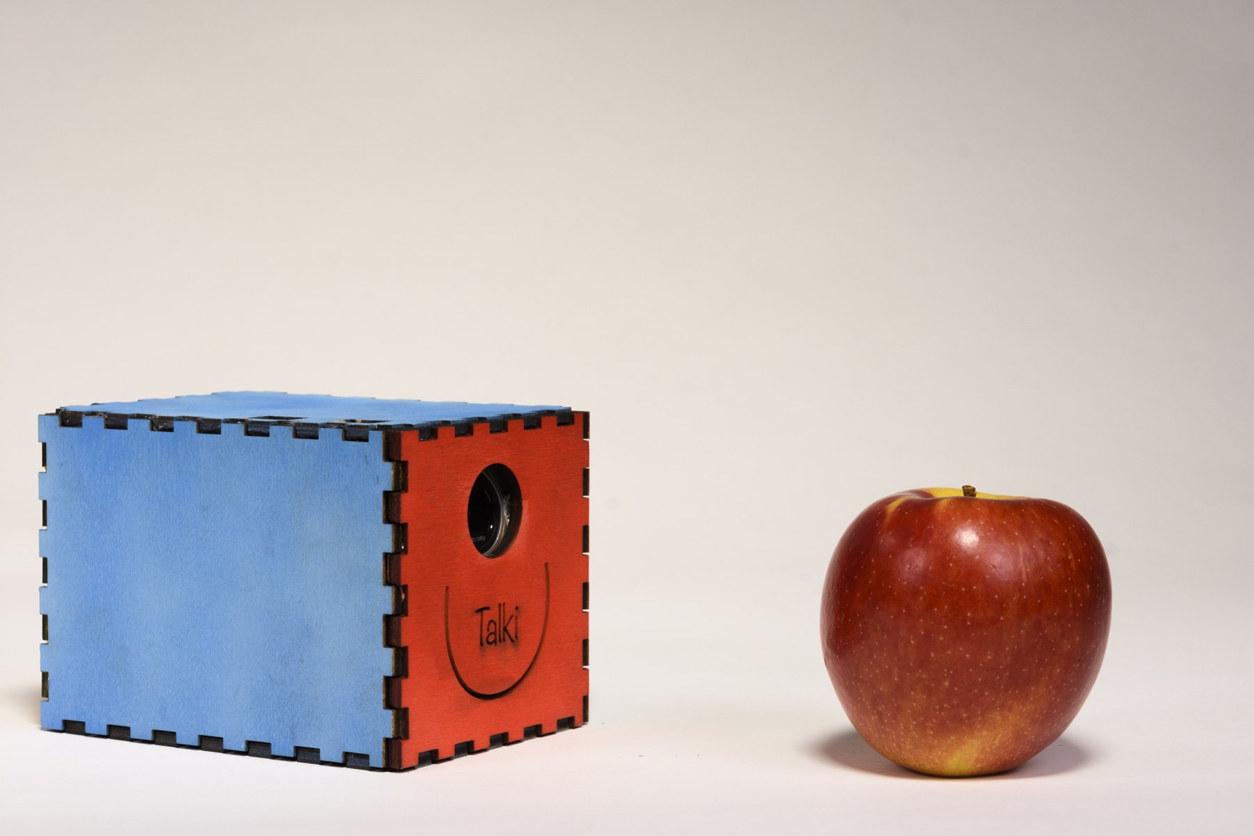 Talki next to an apple, for scale